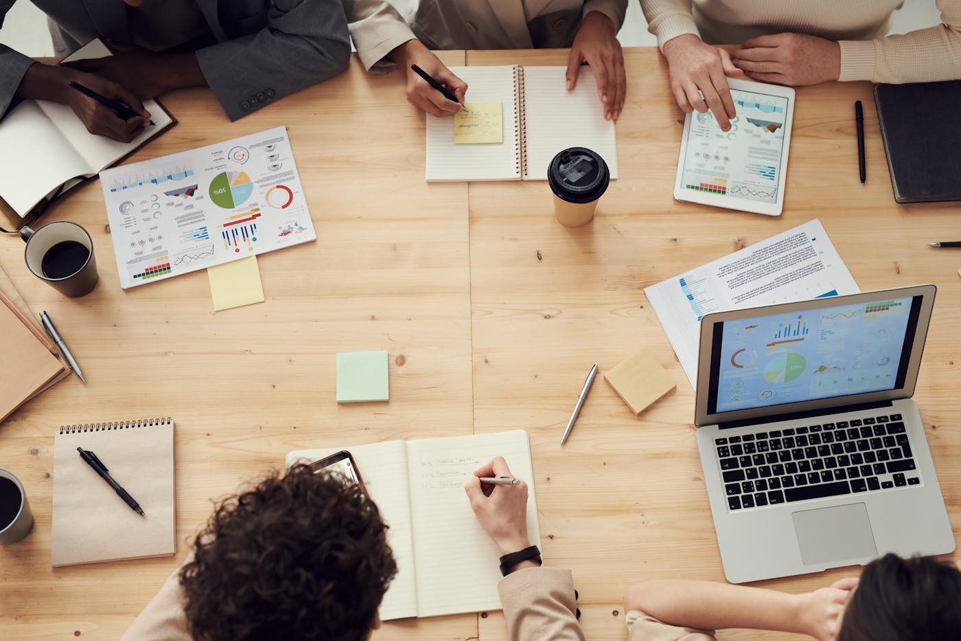 Business meeting desk with reports and working notes